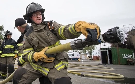 Mayor Randall Stone operating a charged fire hose during the first Chico Fire Citizens Academy