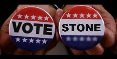 Vote Stone campaign buttons held in two hands