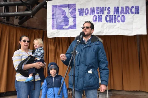 Randall Stone speaking at the Women's March on Chico with his family nearby